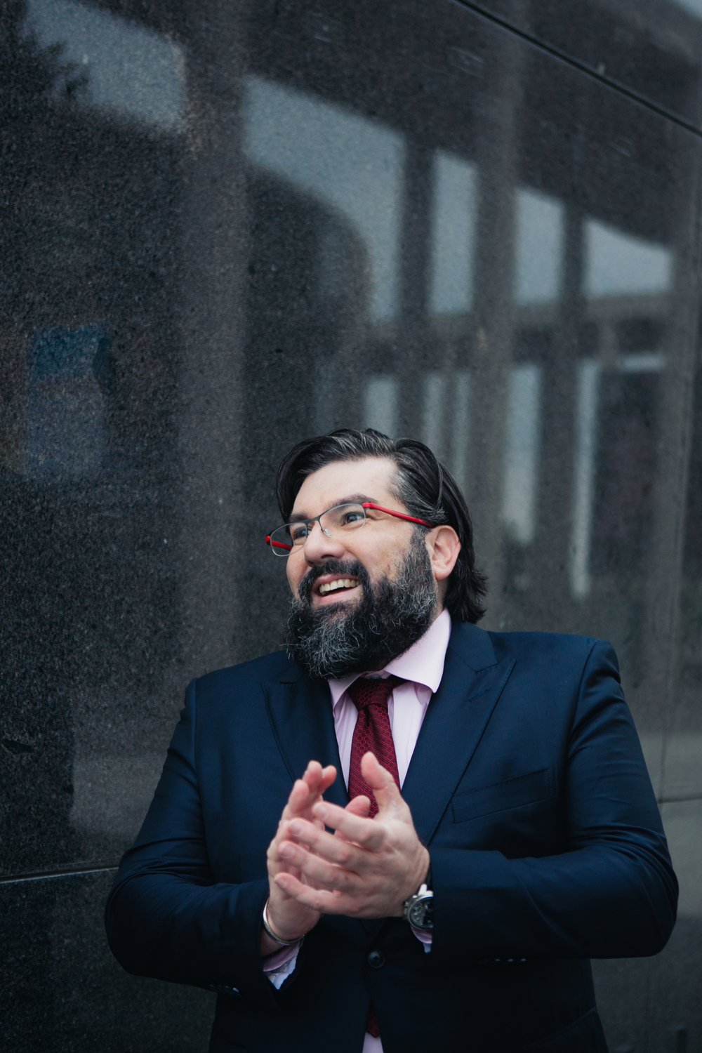 Adam J Schwartz smiling in conversation